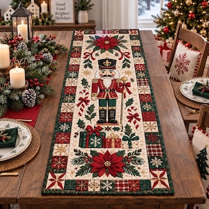 May include: A rectangular table runner featuring a central nutcracker figure, candy canes, and gift boxes, surrounded by poinsettia flowers, holly leaves, and a border of red, green, and cream-colored squares with snowflake and plaid patterns.