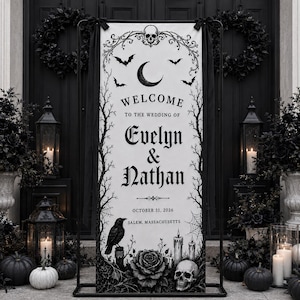 May include: A tall, rectangular wedding welcome sign in black and white featuring a skull, crescent moon, bats, spiderwebs, a raven, roses, and candles. The text reads: Welcome to the wedding of Evelyn & Nathan, October 31, 2026, Salem, Massachusetts.