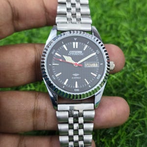 Citizen Automatic Fluted Bazel Men&#39;s Steel Transparent back Day Date Japanese Wrist Watch