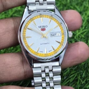 Reloj Seiko 5 vintage automático para hombre, de acero, con día y fecha, 17 joyas, japonés, reacondicionado.