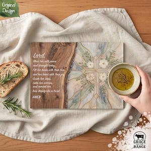 May include: A rectangular wooden serving board featuring a natural live edge on the left and a decorative cross design with floral accents on the right. The board includes the printed text: Lord, Bless her with peace and strength today. Fill her home with Your love and her heart with Your joy. Guide her steps, calm her worries, and remind her how deeply she is loved. AMEN.