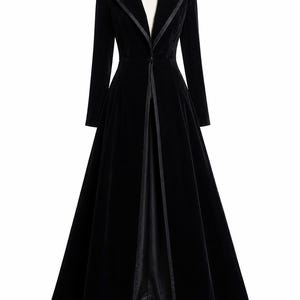 May include: A floor-length black velvet coat featuring a structured collar, long sleeves, and a single front button closure. The garment is accented with smooth satin-like trim along the lapels and the front opening, creating a sleek silhouette.