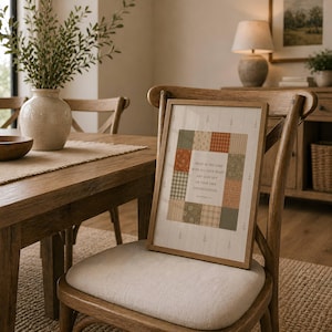 May include: A framed wall art print featuring a central patchwork quilt design in muted tones of green, orange, and cream. The center contains the text: Trust in the Lord with all your heart and lean not on your own understanding. Proverbs 3:5.