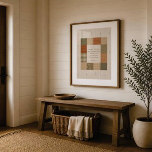 May include: A framed wall art print featuring a patchwork quilt design in muted earth tones of green, orange, and cream. The center square contains the text: Trust in the Lord with all your heart and lean not on your own understanding. Proverbs 3:5.