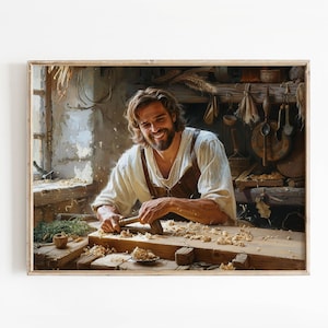 May include: A framed print of a smiling person working with wood in a workshop. The person wears a white shirt and brown leather apron, using a chisel and hammer on a wooden workbench. Sawdust and tools are scattered around.