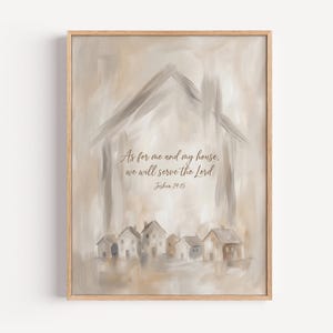 May include: A rectangular wall art print in a light wood frame featuring a beige and cream abstract painted house outline. The text reads: As for me and my house, we will serve the Lord. Joshua 24:15. Below the text are small painted houses.