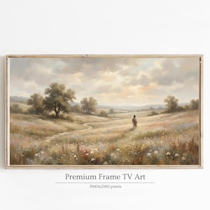 Puede incluir: Impresión artística enmarcada que presenta una serena escena de campo con una figura caminando por un sendero. La obra de arte tiene una paleta de colores neutros con tonos suaves y cálidos. El texto "Premium Frame TV Art" se muestra debajo.