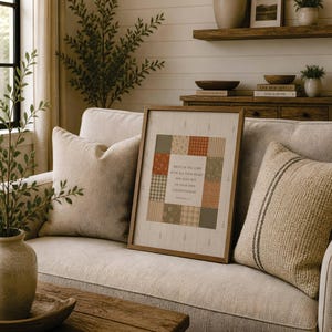 May include: A framed wall art piece featuring a central square with a patchwork quilt design in muted green, orange, and cream tones. The center contains the text: Trust in the Lord with all your heart and lean not on your own understanding.