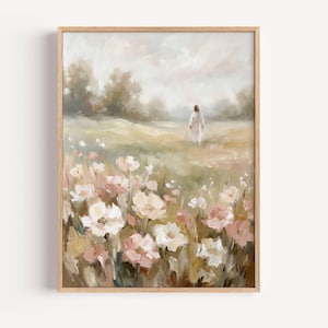 May include: A framed art print featuring a pastoral scene. The artwork depicts a figure walking through a field of wildflowers in soft pastel colors. The foreground is filled with white and pink flowers, with a blurred background of trees and sky.