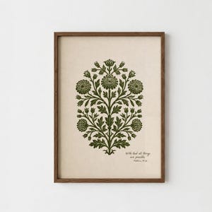 Puede incluir: Una lámina de arte enmarcada con una ilustración botánica de color verde oscuro de una planta floral simétrica sobre un fondo crema. El texto "With God all things are possible. Matthew 19:26" aparece en letras negras pequeñas en la esquina inferior derecha.