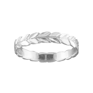May include: A silver ring with a leaf design. The leaves are arranged in a continuous pattern around the band.