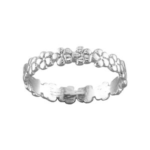 May include: A silver ring with a delicate floral design. The ring is made of small, interconnected flower shapes.