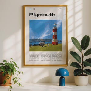 May include: A framed wall art print titled Plymouth featuring a graphic illustration of a red and white striped lighthouse on a grassy hill under a blue sky. The print includes small colored circles at the top and descriptive text at the bottom.