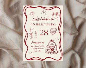 May include: A cream-colored birthday invitation with a burgundy border and illustrations. The text reads "Let's Celebrate, Rachel is turning 28." Includes a cake, champagne, and other celebratory graphics. The invitation also includes the date, time, and location.
