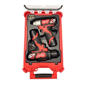 May include: A red and black Milwaukee power tool set in a red carrying case. The set includes a drill and an impact driver, along with various drill bits. The case is open, revealing the tools neatly arranged in a black foam insert.