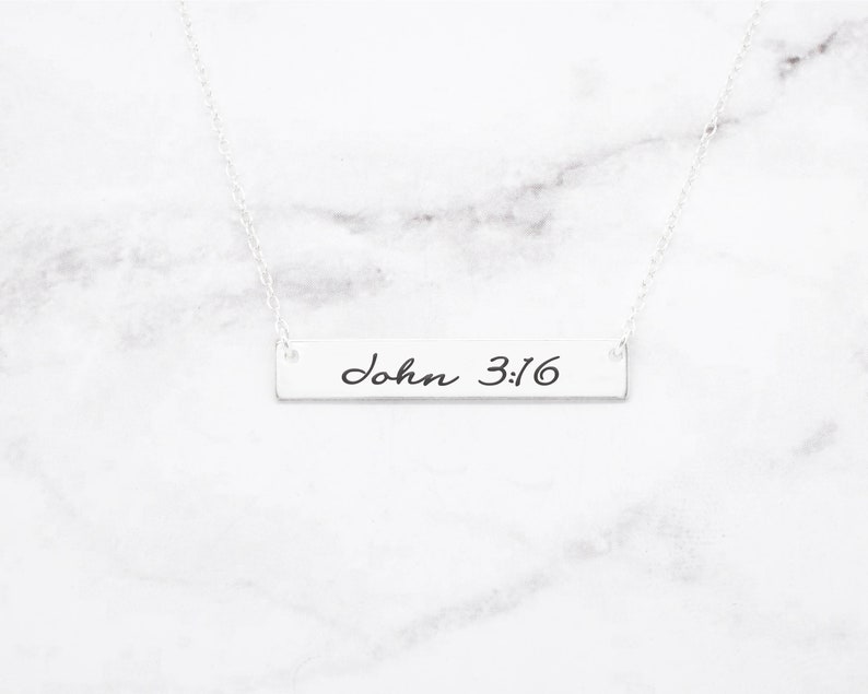 May include: Silver necklace with a bar pendant that says "John 3:16" in cursive script.