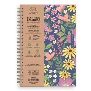 May include: A spiral-bound planner with a floral design on a navy blue background. The cover features pink, yellow, and white flowers. Text on the cover includes "Planning Calendar" and the dates "Jul 2026 - Jun 2027". The planner is made from recycled plastic and is recyclable.