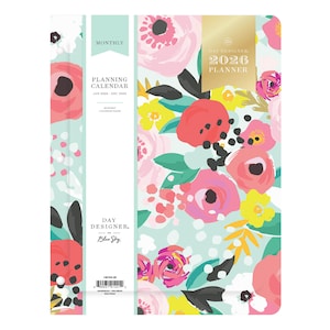 May include: A floral 2026 planner with a light blue background and a colorful flower pattern. The planner includes the text "DAY DESIGNER" and "PLANNING CALENDAR JAN 2026 - DEC 2026". The planner is a perfect tool for organizing schedules and appointments.