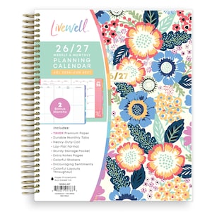 May include: A floral-patterned planner with a gold spiral binding. The cover features a colorful flower design in shades of blue, coral, and yellow. The planner includes weekly and monthly planning pages for July 2026 to June 2027, with bonus months and extra features.