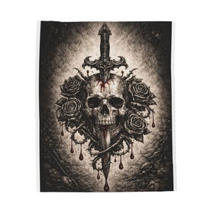 May include: A black and white blanket featuring a skull pierced by a sword, surrounded by roses and thorns. Blood drips from the skull and sword. The design has a gothic or dark aesthetic.