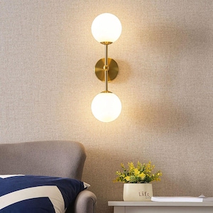 Mid-Century Modern Brass Wall Sconce: Opal Glass Globe Light