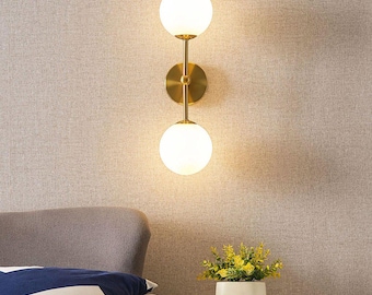 Mid-Century Modern Brass Wall Sconce: Opal Glass Globe Light