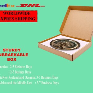 May include: An open cardboard box with a decorative oval tray inside. The tray has a detailed design in shades of brown and gold. The box is on a light green background. Text on the image reads "WORLDWIDE EXPRES SHIPPING" and "STURDY UNBRAEKABLE BOX."