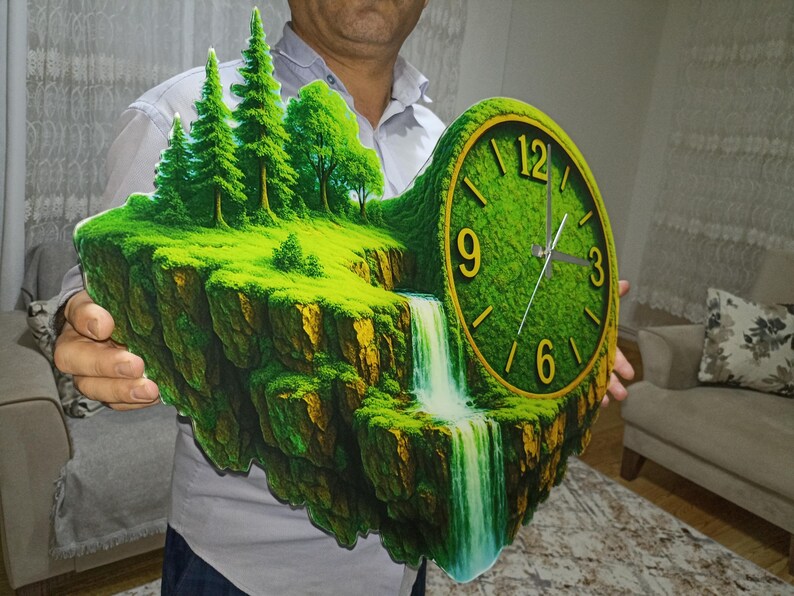 May include: A unique wall clock featuring a landscape design with a waterfall and trees. The clock face is green with gold numerals. The clock is approximately 18 inches wide and 15 inches tall.
