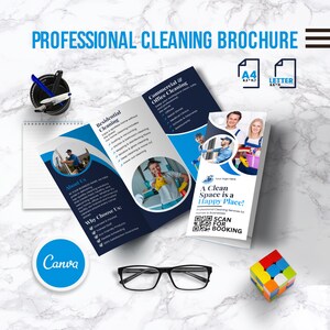 May include: A professional cleaning brochure with the text "PROFESSIONAL CLEANING BROCHURE". The brochure includes images of cleaning staff and services. Also included are a pair of black glasses, a notepad, a pen holder, a Rubik's cube, and a Canva logo.