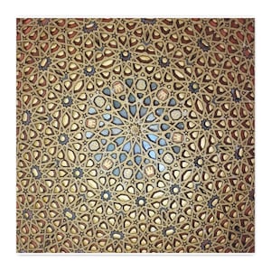 May include: A decorative panel featuring an intricate geometric pattern of interlocking stars and polygons. The design is composed of gold-toned wooden lattice work with inlaid accents in shades of red, blue, and cream, creating a complex mosaic.