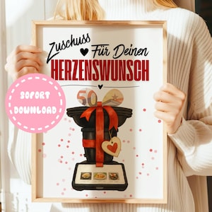 Può includere: Stampa incorniciata con il testo "Zuschuss Für Deinen Herzenswunsch" in nero e rosso. La stampa presenta un oggetto decorativo nero con un nastro rosso e un cuore di legno. Un cerchio rosa dice "SOFORT DOWNLOAD".