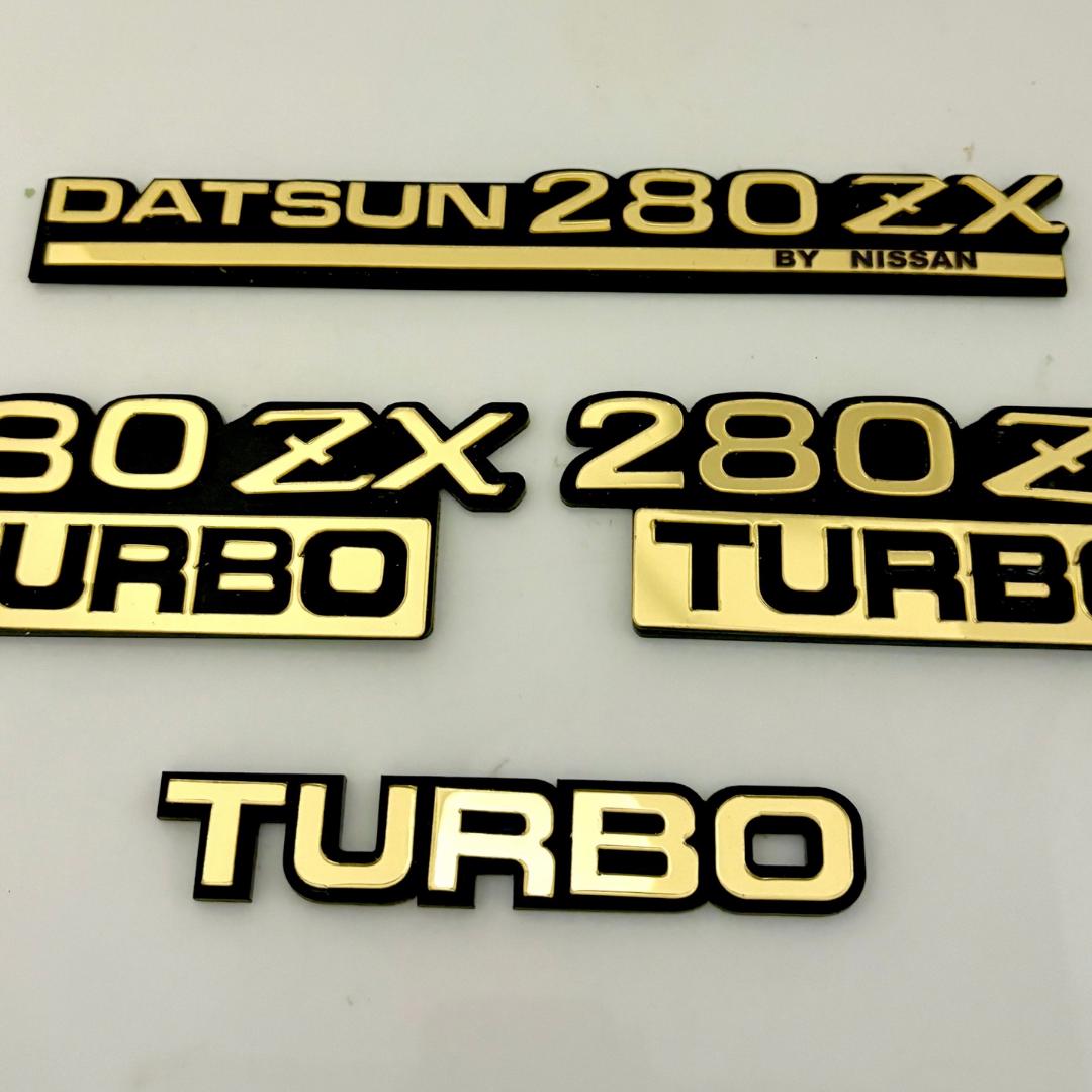 Datsun 280ZX Turbo Emblem Badge Set – Black & Gold Acrylic Plastic