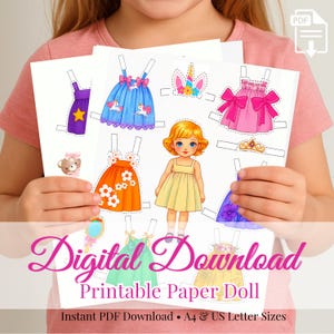 Puede incluir: Hojas de muñecas de papel imprimibles con una muñeca y varios atuendos. Los atuendos incluyen vestidos en azul, rosa, naranja y verde, además de accesorios como una diadema de unicornio y una corona. Se muestra el texto "Digital Download Printable Paper Doll".
