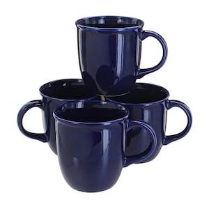 May include: Four navy blue ceramic mugs stacked together. Each mug has a rounded body, a large handle, and a slightly flared rim. The mugs are glossy and reflect the light, creating highlights on their surfaces. The mugs are a solid color.
