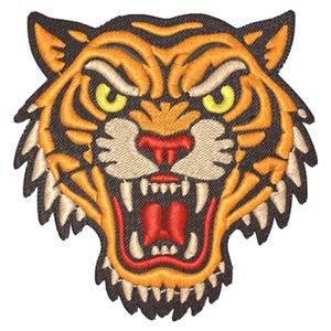 May include: Embroidered tiger head patch with orange, yellow, and black detailing. The tiger's mouth is open, showing white teeth and a red tongue. The patch has a detailed, textured design.