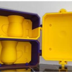 May include: A set of three ceramic mugs with a speckled, matte finish. The mugs are in shades of cream, light gray, and dark gray. Each mug has a simple, minimalist design and a rounded handle. Perfect for coffee or tea.