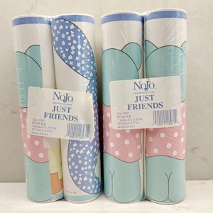 May include: Several rolls of baby wallpaper with a repeating pattern of elephants, polka dots, and clouds in pastel colors. The rolls are labeled "JUST FRIENDS" and include product information.
