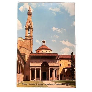 May include: A view of the Cappella dei Pazzi, a chapel in the Basilica di Santa Croce in Florence, Italy. The chapel was designed by Filippo Brunelleschi and features a dome, columns, and a bell tower.