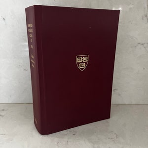 May include: A maroon hardcover book with gold lettering on the spine that reads "Harvard College Class of 1953 Fifty-fifth Anniversary Report". The book has a gold Harvard University crest on the front cover.