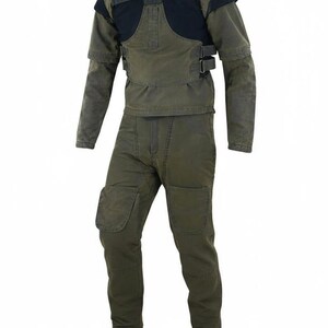 May include: A two-piece olive green work suit. The jacket has a black padded chest and shoulder area, with two buckles. The pants have knee patches. The suit is paired with brown boots.