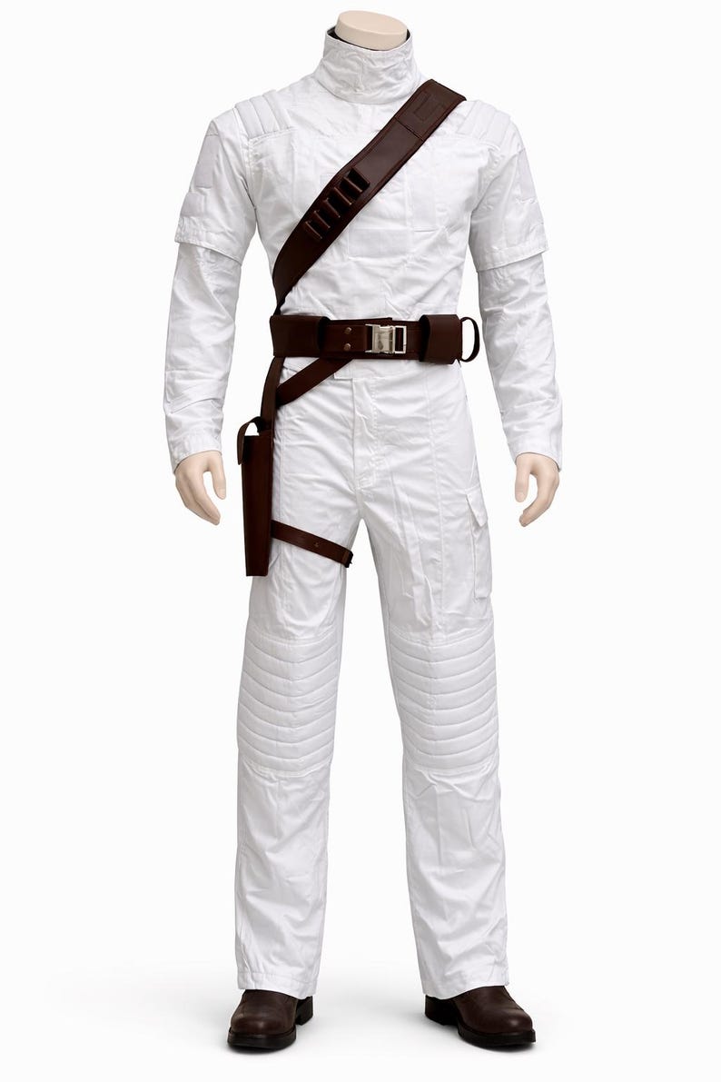 May include: A white jumpsuit with a high collar, quilted detailing, and brown leather belt and holster. The costume includes a shoulder strap with multiple pouches and brown leather boots. The outfit is displayed on a mannequin.