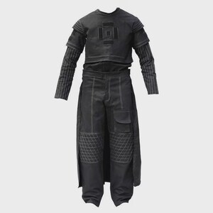 May include: A black two-piece outfit. The top has short sleeves and a geometric design. The matching trousers have a cargo pocket and quilted knee details. White stitching accents the seams. The long sleeves have a striped pattern.