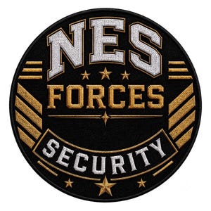 May include: A circular embroidered patch with a black background. It features the white text NES at the top, the gold text FORCES in the centre, and the white text SECURITY at the bottom. Gold stars and diagonal gold stripes accent the design.