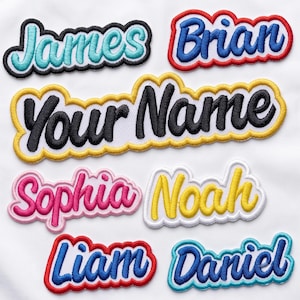 May include: A collection of embroidered name patches featuring various colours and styles. The patches display the names James, Brian, Your Name, Sophia, Noah, Liam, and Daniel in cursive script with thick, colourful borders and white backgrounds.
