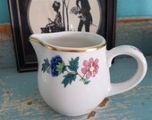 Sweet little china creamer with gold trim and lovely floral design Syracuse china