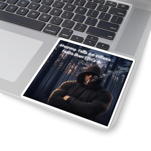 May include: A sticker featuring a man in a black hoodie and sunglasses, smoking a cigarette, with arms crossed. The background shows a forest. Text on the sticker reads: "Warning, falls for villains faster than FMCs do."
