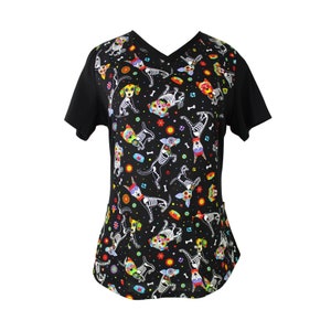 May include: Black scrub top with a colorful print of skeleton dogs with flowers and bones.