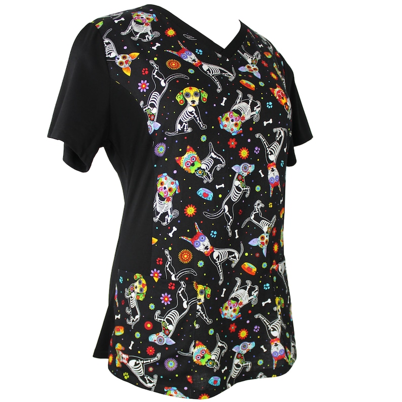 May include: Black scrub top with a colorful Day of the Dead dog print. The dogs are wearing flowers and have sugar skulls on their faces.