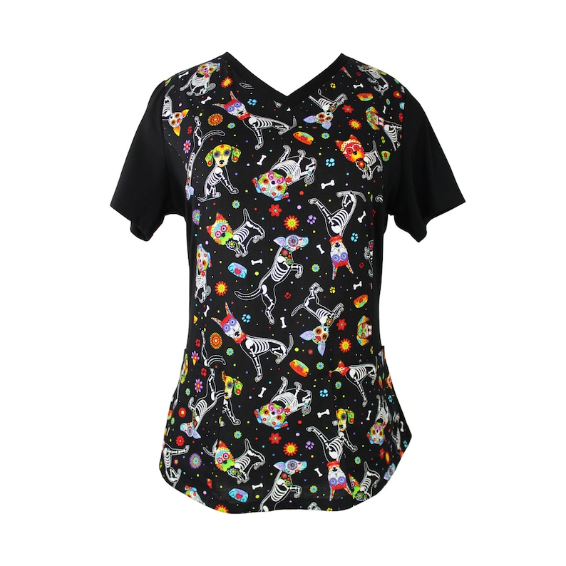 May include: Black scrub top with a colorful print of skeleton dogs with flowers and bones.