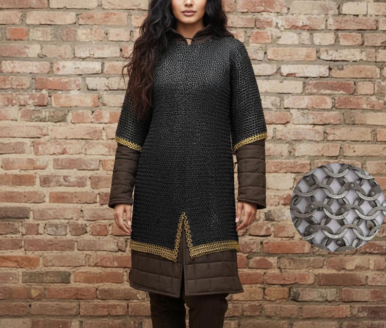 May include: A black chainmail tunic with gold trim on the sleeves and hem. The sleeves are brown with gold accents. The tunic is long-sleeved and reaches the mid-thigh. A close-up of the chainmail is shown in a circular inset.